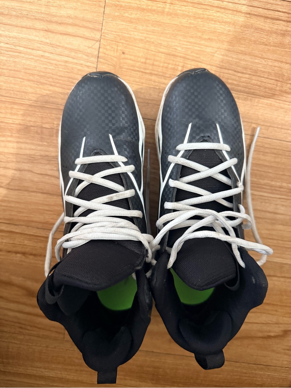 Under Armour Black High-Top Kids cleats with White Laces